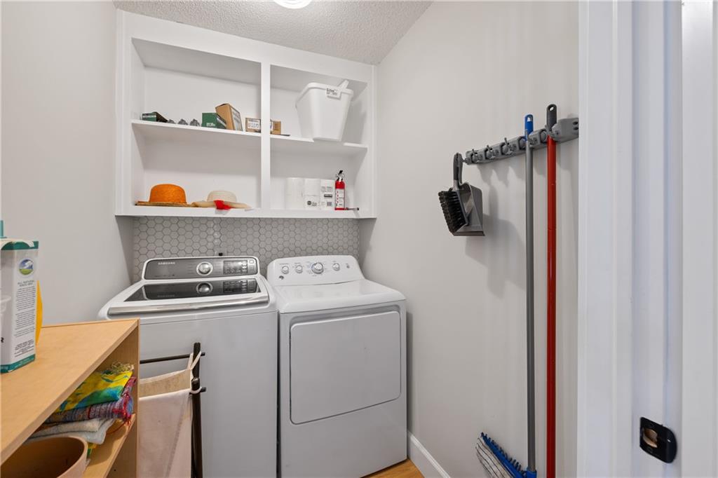 1631 Arrowhead Road Greensboro, GA 30642 - Photo 25 of 83 a view of storage and utility room with washer and dryer