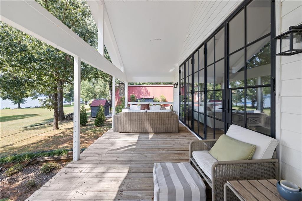 1631 Arrowhead Road Greensboro, GA 30642 - Photo 34 of 83 a view of a patio with couches table and chairs and potted plants