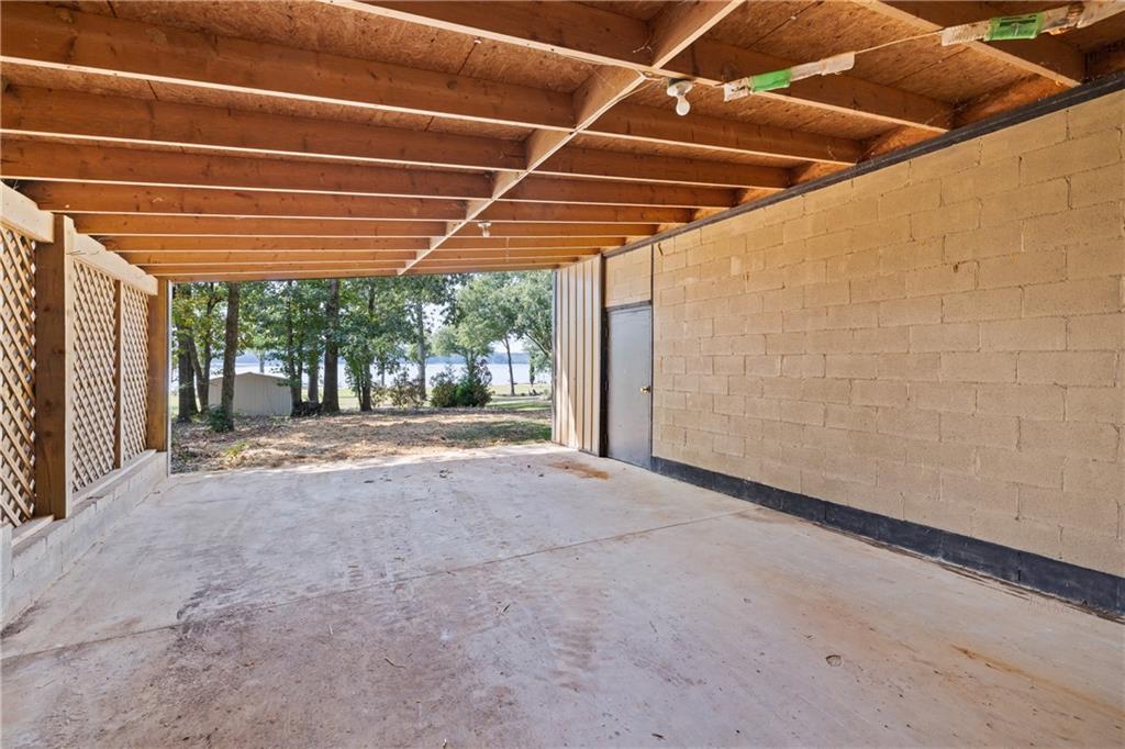 1631 Arrowhead Road Greensboro, GA 30642 - Photo 37 of 83 a view of a room with wooden floor and windows