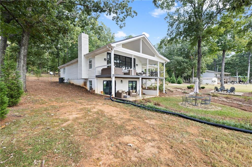 1631 Arrowhead Road Greensboro, GA 30642 - Photo 60 of 83 a view of a house with backyard and sitting area