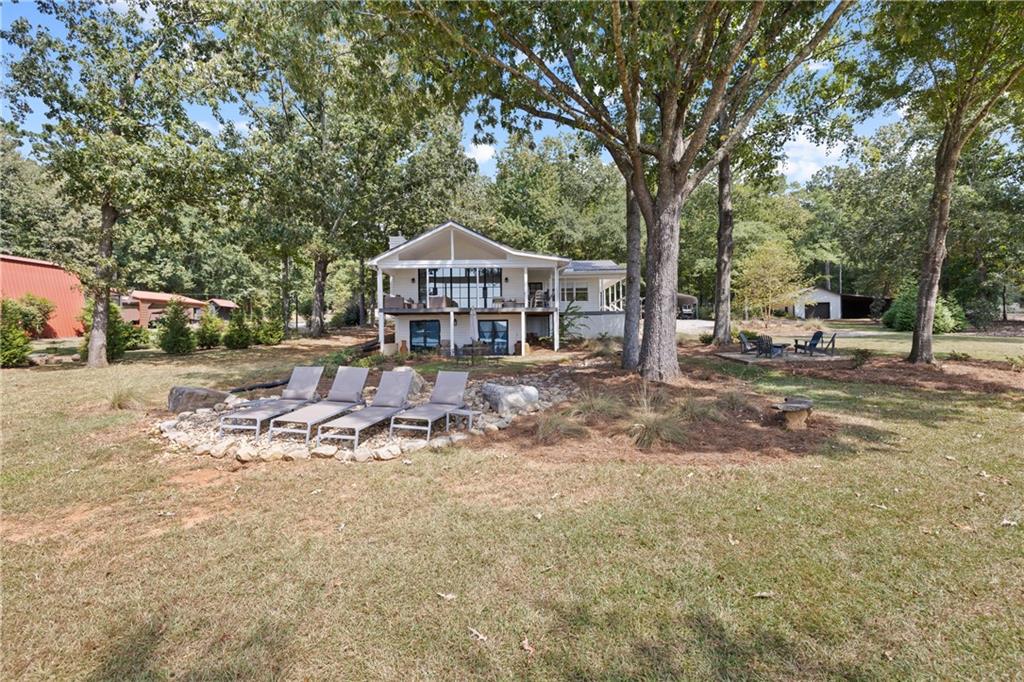 1631 Arrowhead Road Greensboro, GA 30642 - Photo 61 of 83 a view of a house with backyard and sitting area