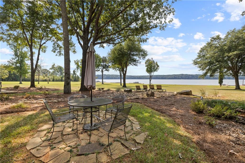 1631 Arrowhead Road Greensboro, GA 30642 - Photo 64 of 83 a view of a lake with a yard