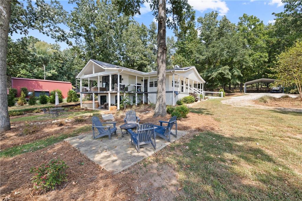 1631 Arrowhead Road Greensboro, GA 30642 - Photo 67 of 83 a view of a house with backyard and sitting area