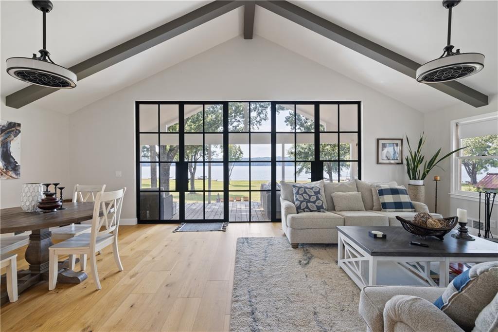 1631 Arrowhead Road Greensboro, GA 30642 - Photo 7 of 83 a living room with furniture and a floor to ceiling window