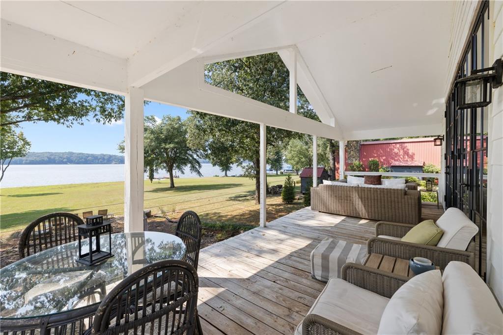 1631 Arrowhead Road Greensboro, GA 30642 - Photo 74 of 83 a living room with furniture and a floor to ceiling window