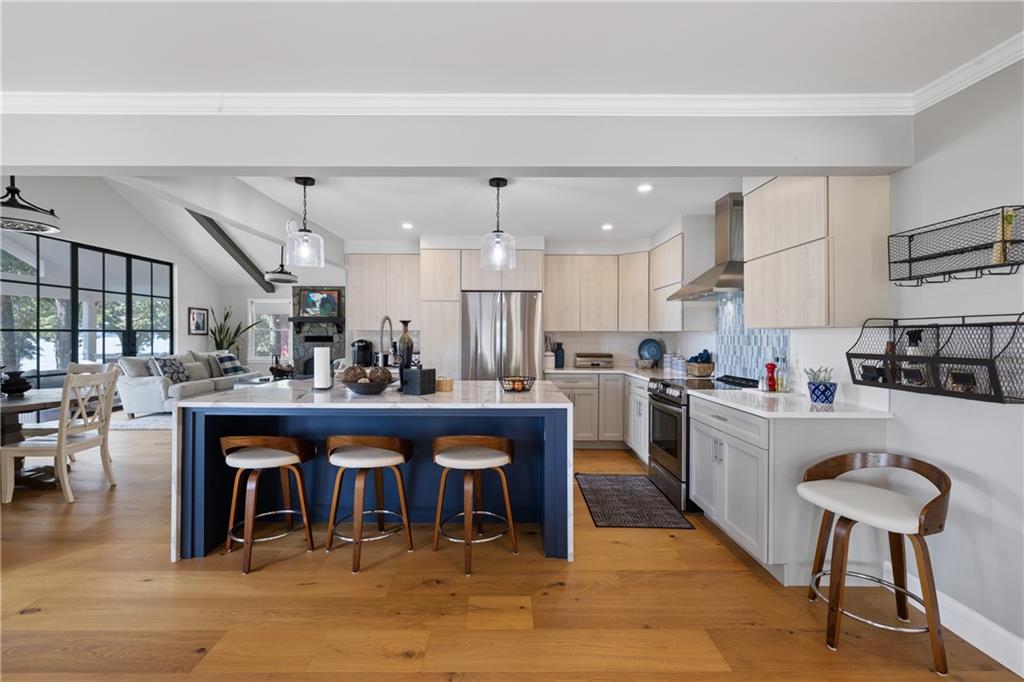 1631 Arrowhead Road Greensboro, GA 30642 - Photo 8 of 83 a kitchen with stainless steel appliances granite countertop a table chairs sink and cabinets