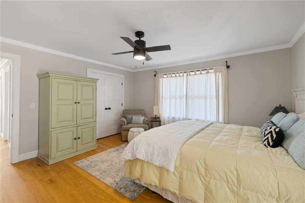 1631 Arrowhead Road Greensboro, GA 30642 - Photo 82 of 83 a spacious bedroom with a bed and a dresser