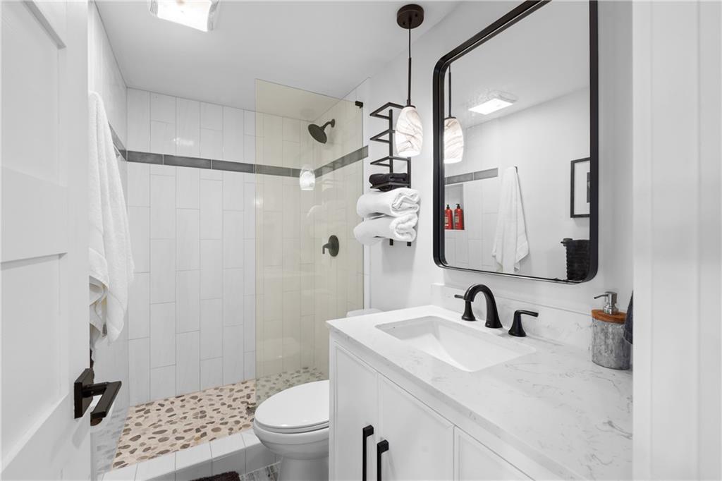 1631 Arrowhead Road Greensboro, GA 30642 - Photo 83 of 83 a bathroom with a sink toilet and shower