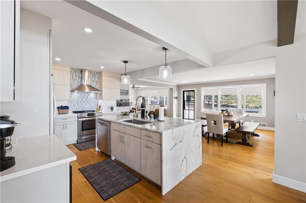1631 Arrowhead Road Greensboro, GA 30642 - Photo 10 of 83 a kitchen with stainless steel appliances granite countertop a stove oven and a refrigerator with white cabinets