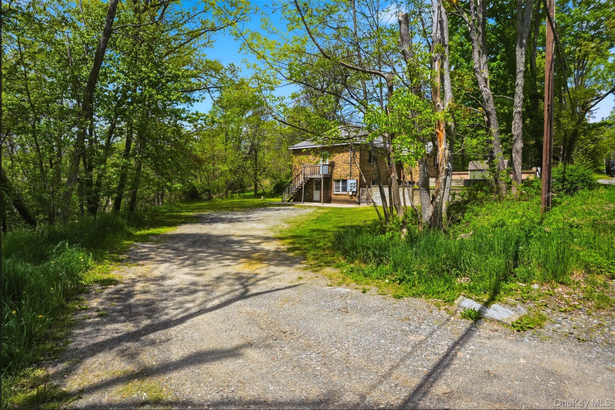 6 Short Road Wurtsboro, NY 12790 - Photo 7 of 48 a view of a big yard with plants and large trees