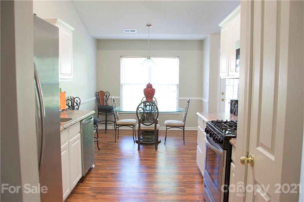 13415 Philip Michael Road Huntersville, NC 28078 - Photo 13 of 30 a living room with furniture and a window