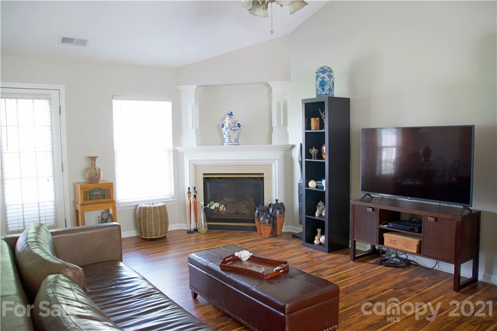 13415 Philip Michael Road Huntersville, NC 28078 - Photo 16 of 30 a living room with furniture and a fireplace