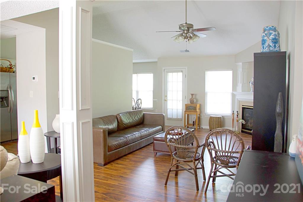 13415 Philip Michael Road Huntersville, NC 28078 - Photo 18 of 30 a living room with furniture and a chandelier