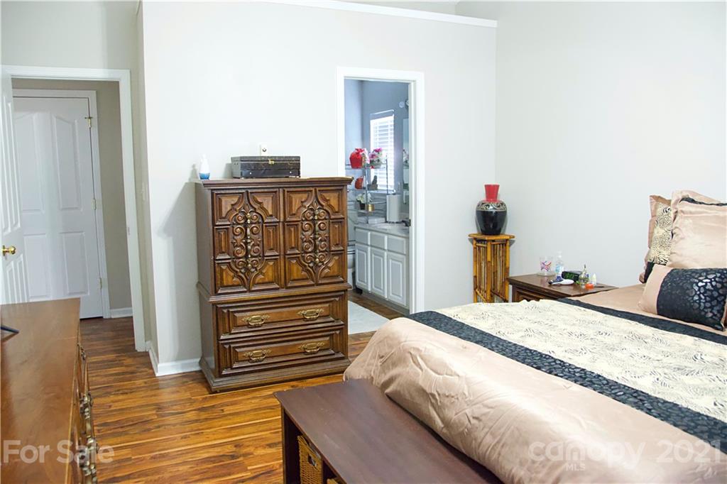 13415 Philip Michael Road Huntersville, NC 28078 - Photo 20 of 30 a bed sitting in a bedroom and chair