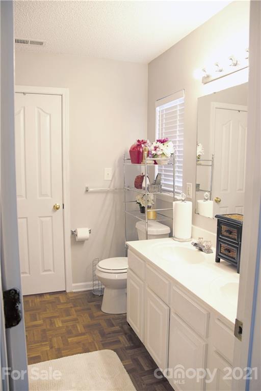 13415 Philip Michael Road Huntersville, NC 28078 - Photo 23 of 30 a bathroom with a sink a toilet and shower