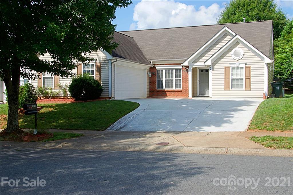 13415 Philip Michael Road Huntersville, NC 28078 - Photo 30 of 30 a view of a white house next to a yard and trees