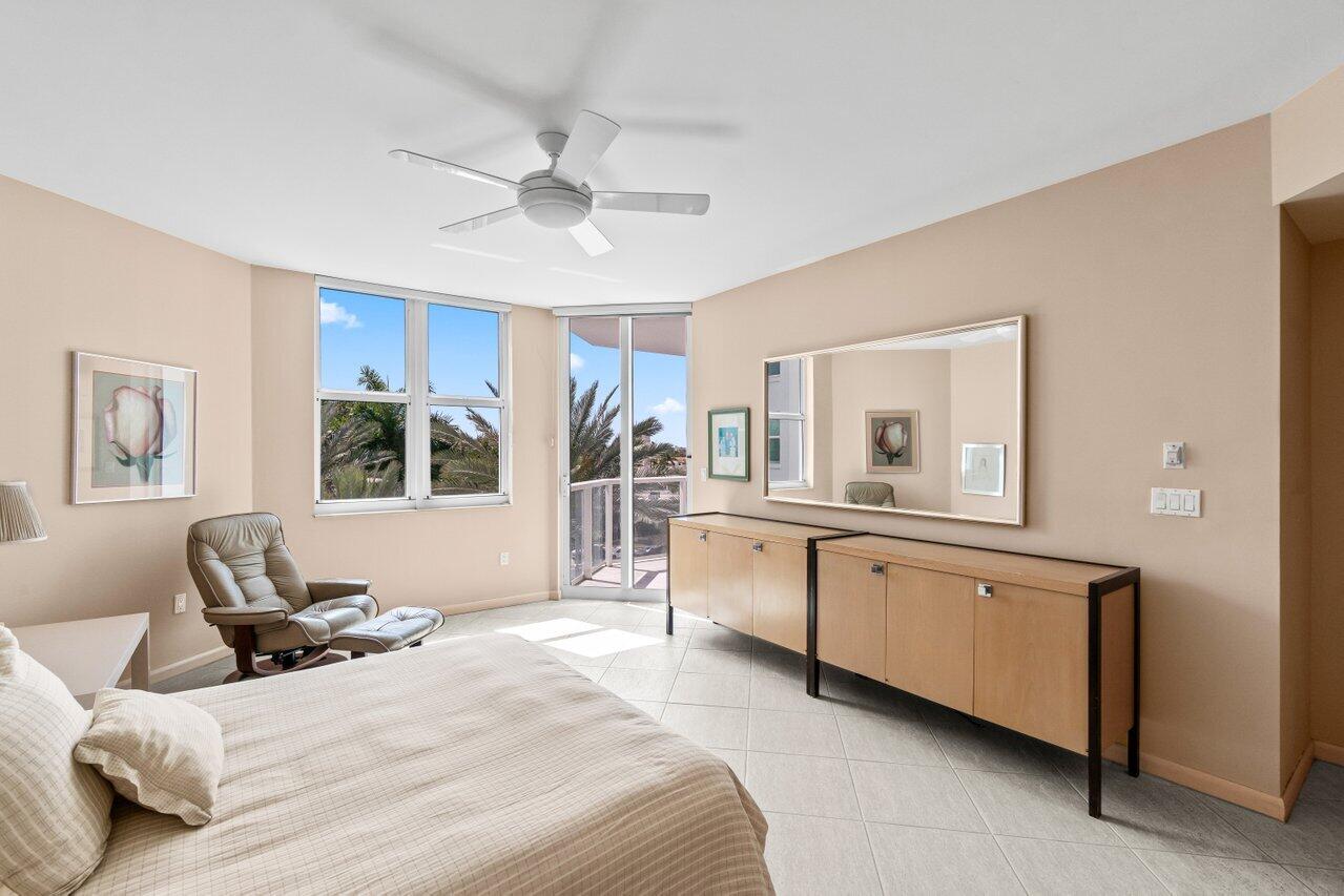 500 Southeast Mizner Boulevard, Unit A411 Boca Raton, FL 33432 - Photo 24 of 67 a bedroom with a bed and a large window