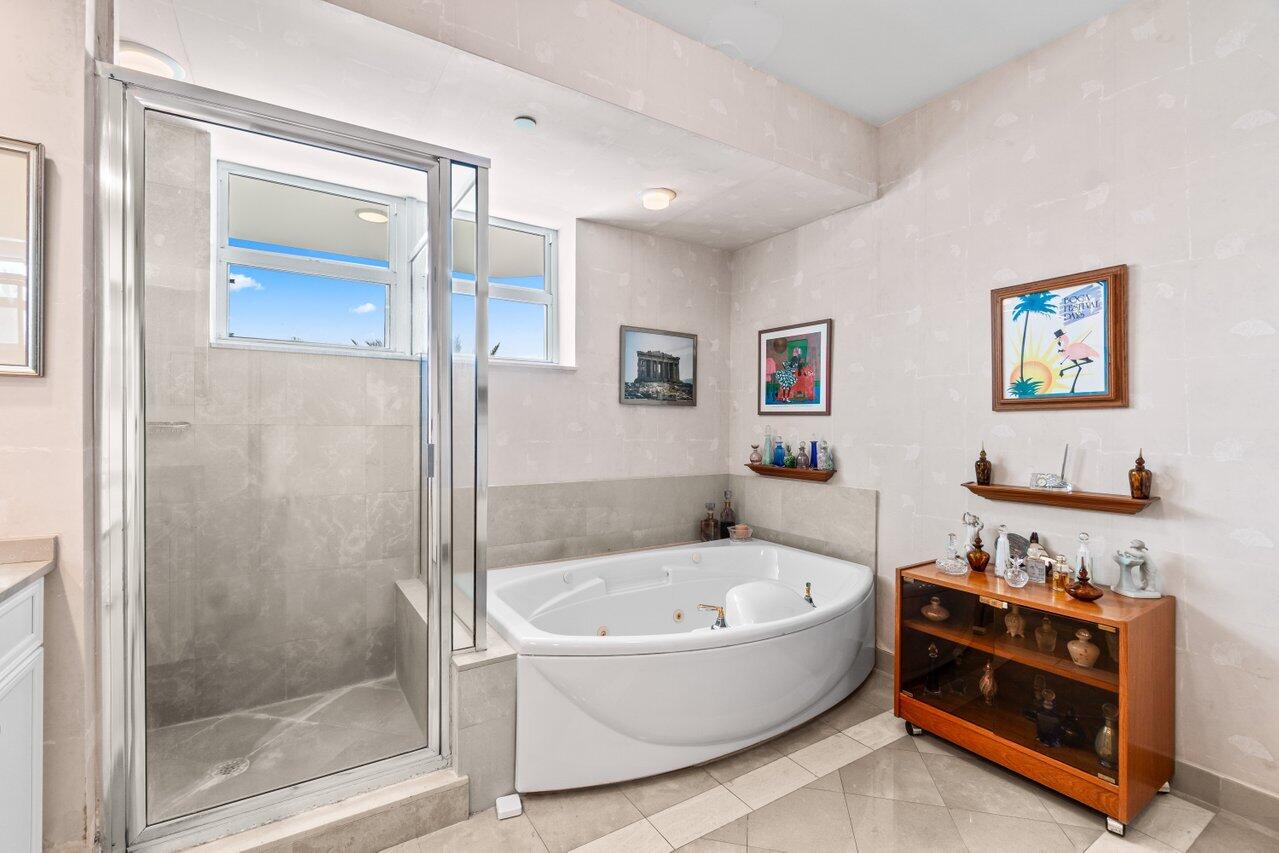500 Southeast Mizner Boulevard, Unit A411 Boca Raton, FL 33432 - Photo 28 of 67 a bathroom with a tub and a shower