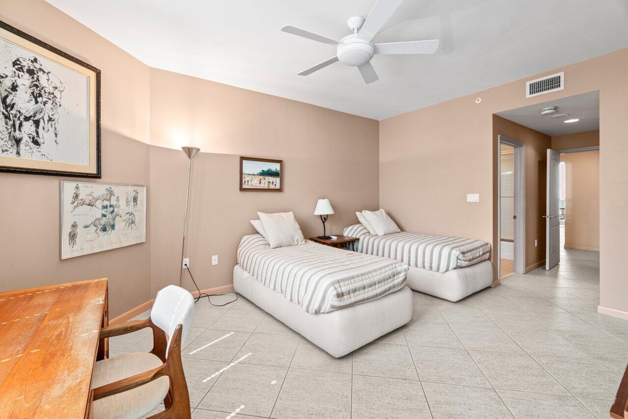 500 Southeast Mizner Boulevard, Unit A411 Boca Raton, FL 33432 - Photo 33 of 67 a spacious bedroom with a bed and a painting on the wall