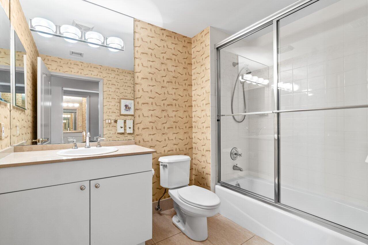 500 Southeast Mizner Boulevard, Unit A411 Boca Raton, FL 33432 - Photo 34 of 67 a bathroom with a shower sink mirror and toilet