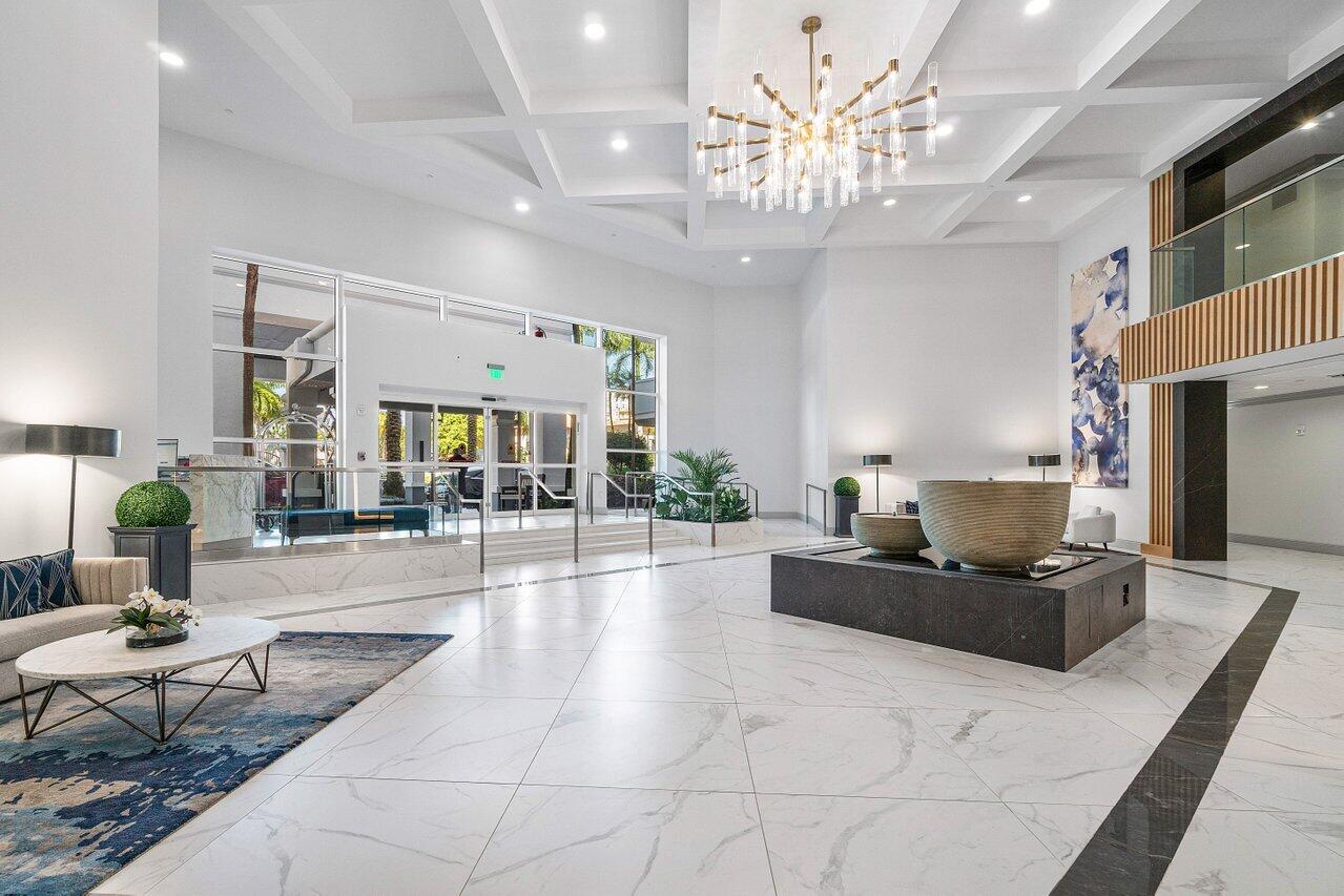 500 Southeast Mizner Boulevard, Unit A411 Boca Raton, FL 33432 - Photo 39 of 67 a living room with furniture a chandelier and a chandelier