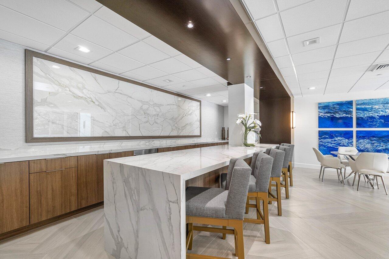 500 Southeast Mizner Boulevard, Unit A411 Boca Raton, FL 33432 - Photo 49 of 67 a view of a dining room with furniture window and wooden floor