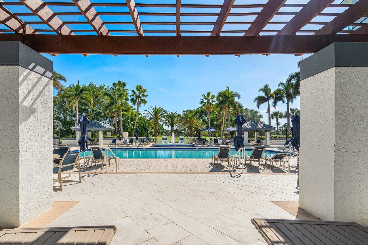 500 Southeast Mizner Boulevard, Unit A411 Boca Raton, FL 33432 - Photo 65 of 67 a view of a swimming pool with a patio and a garden
