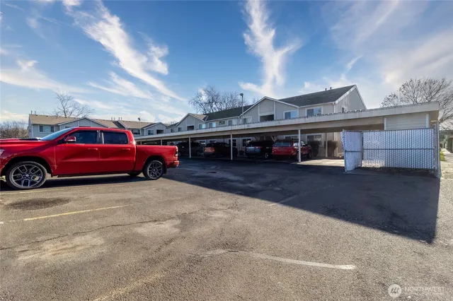 a view of a car in front of a building