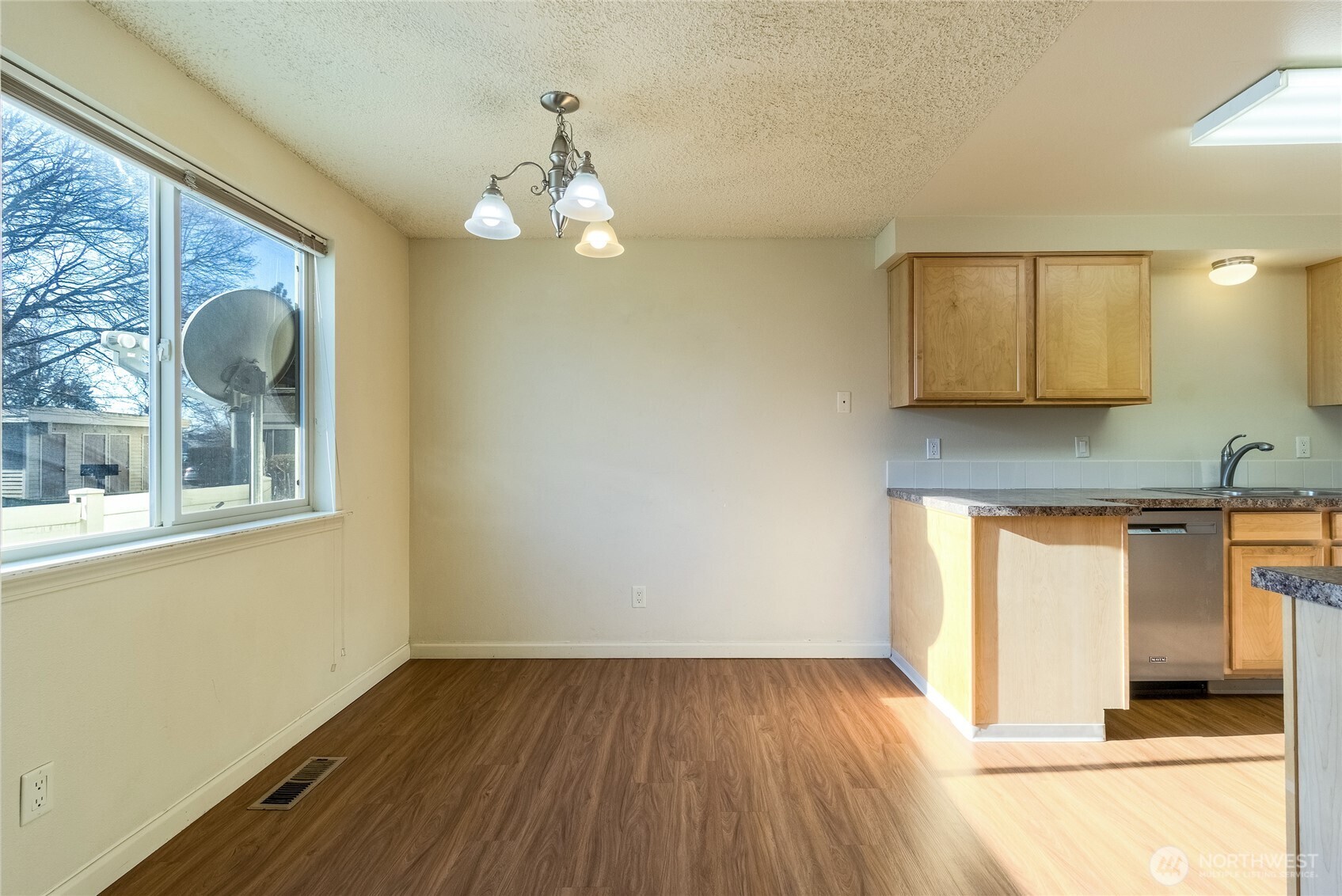 1918 J Street, Unit 102 Walla Walla, WA 99362 - Photo 5 of 26 a view of a livingroom with wooden floor and a large window