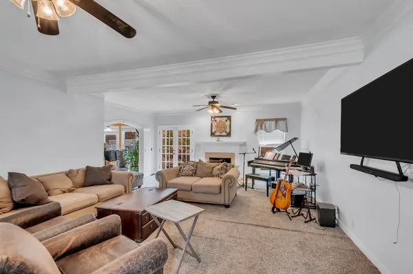 a living room with furniture and a flat screen tv