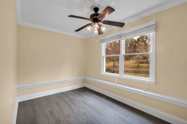 a kitchen with stainless steel appliances granite countertop a refrigerator and a window