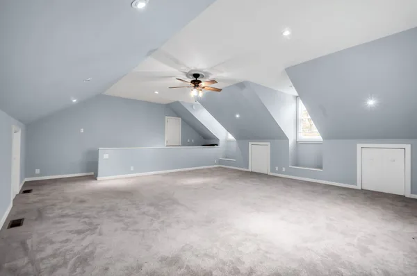 en view interior of a house with a ceiling fan and window