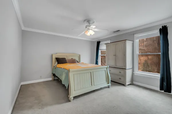 a bathroom with a granite countertop sink a shower and a mirror