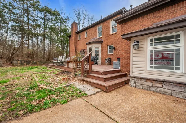a view of a backyard with sitting area