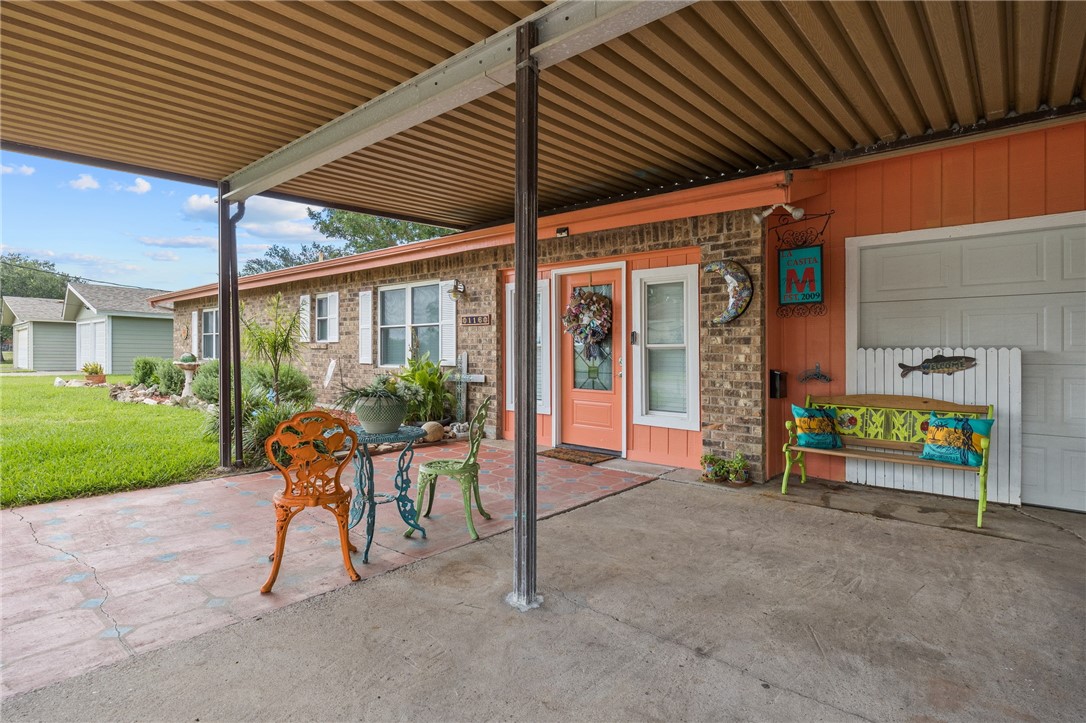 116 Sunset Drive Mathis, TX 78368 - Photo 23 of 32 a view of a porch with furniture and garden