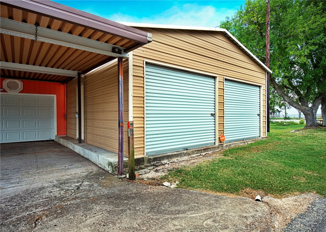 116 Sunset Drive Mathis, TX 78368 - Photo 24 of 32 a front view of a house with garden