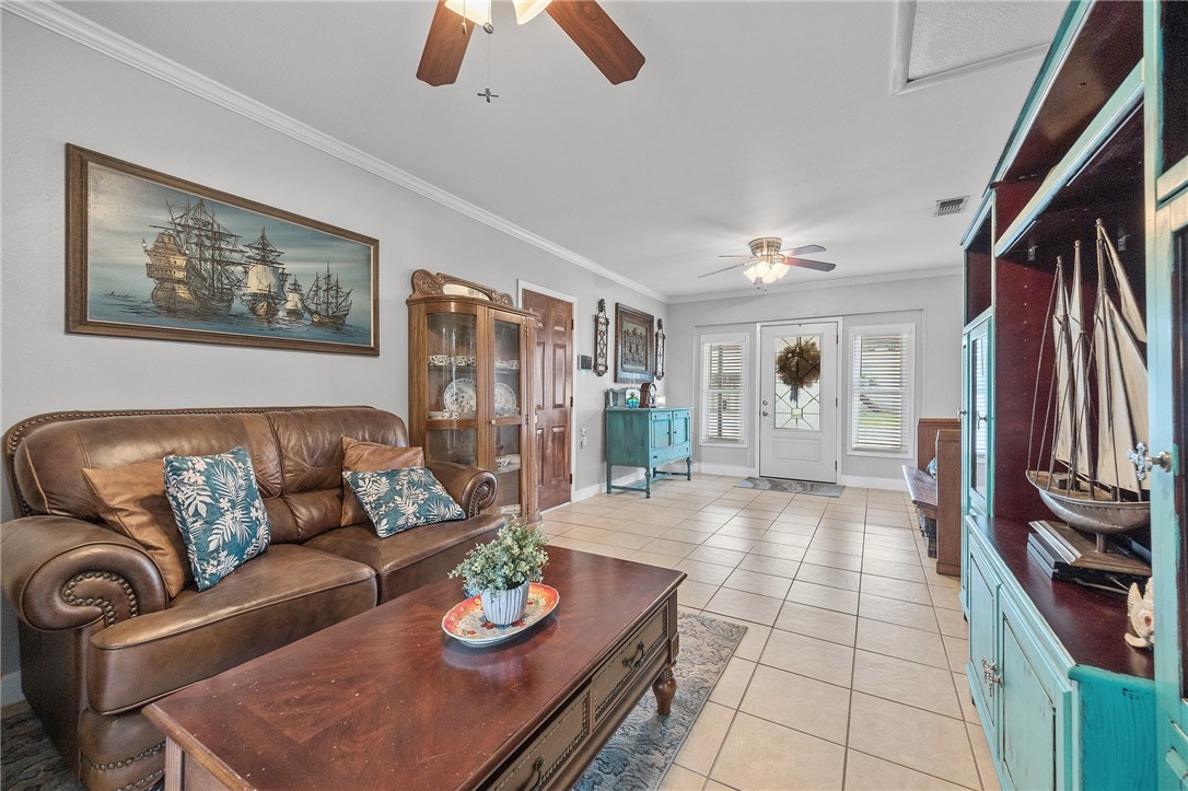 116 Sunset Drive Mathis, TX 78368 - Photo 4 of 32 a living room with furniture and a flat screen tv