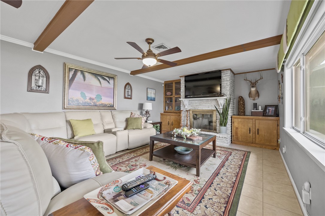 116 Sunset Drive Mathis, TX 78368 - Photo 10 of 32 a living room with furniture ceiling fan and a rug