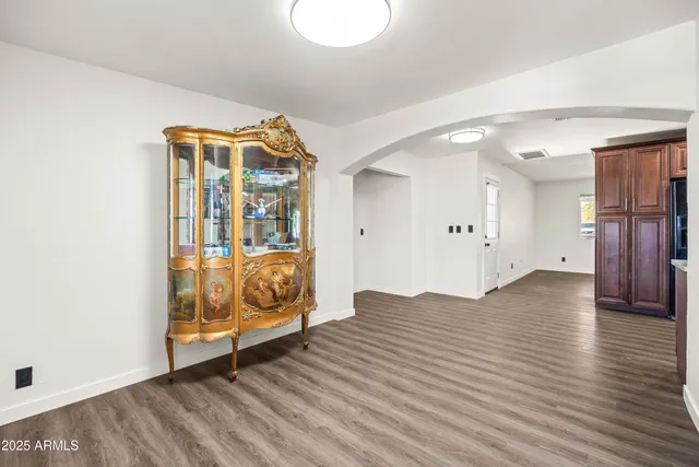 a view of an entryway with wooden floor