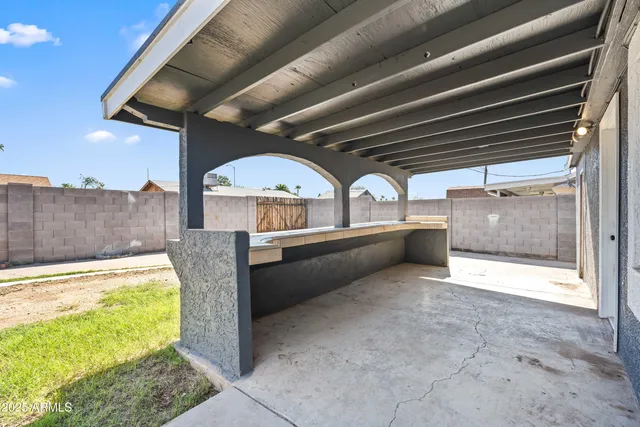 a view of an empty room with a fireplace