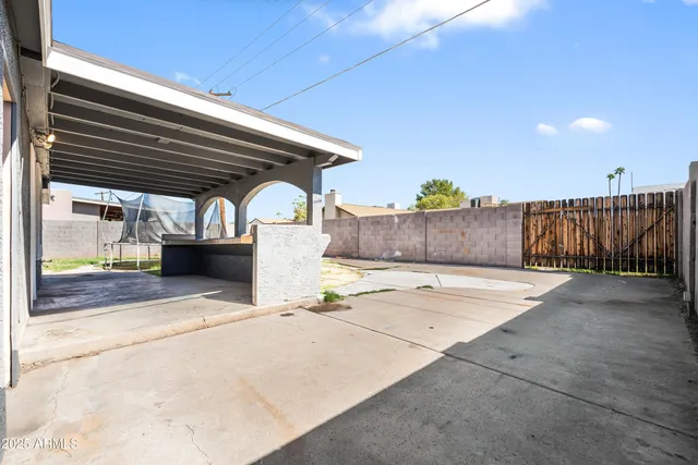a swimming pool with outdoor seating and stairs