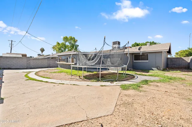 a view of a swimming pool with a lounge chair