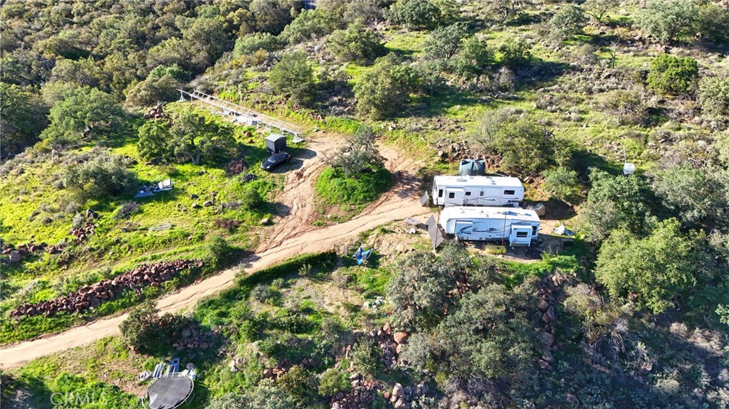 3 Vuelta Grande Road Temecula, CA 92590 - Photo 22 of 37 an aerial view of a house with a yard and large trees