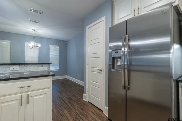 a view of a kitchen from the hallway
