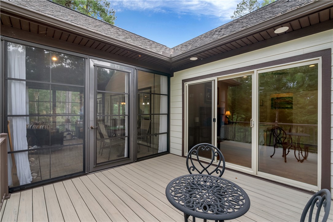 329 High Hampton Road Salem, SC 29676 - Photo 39 of 47 An inviting wooden deck connects seamlessly to the interior through expansive sliding glass doors.
