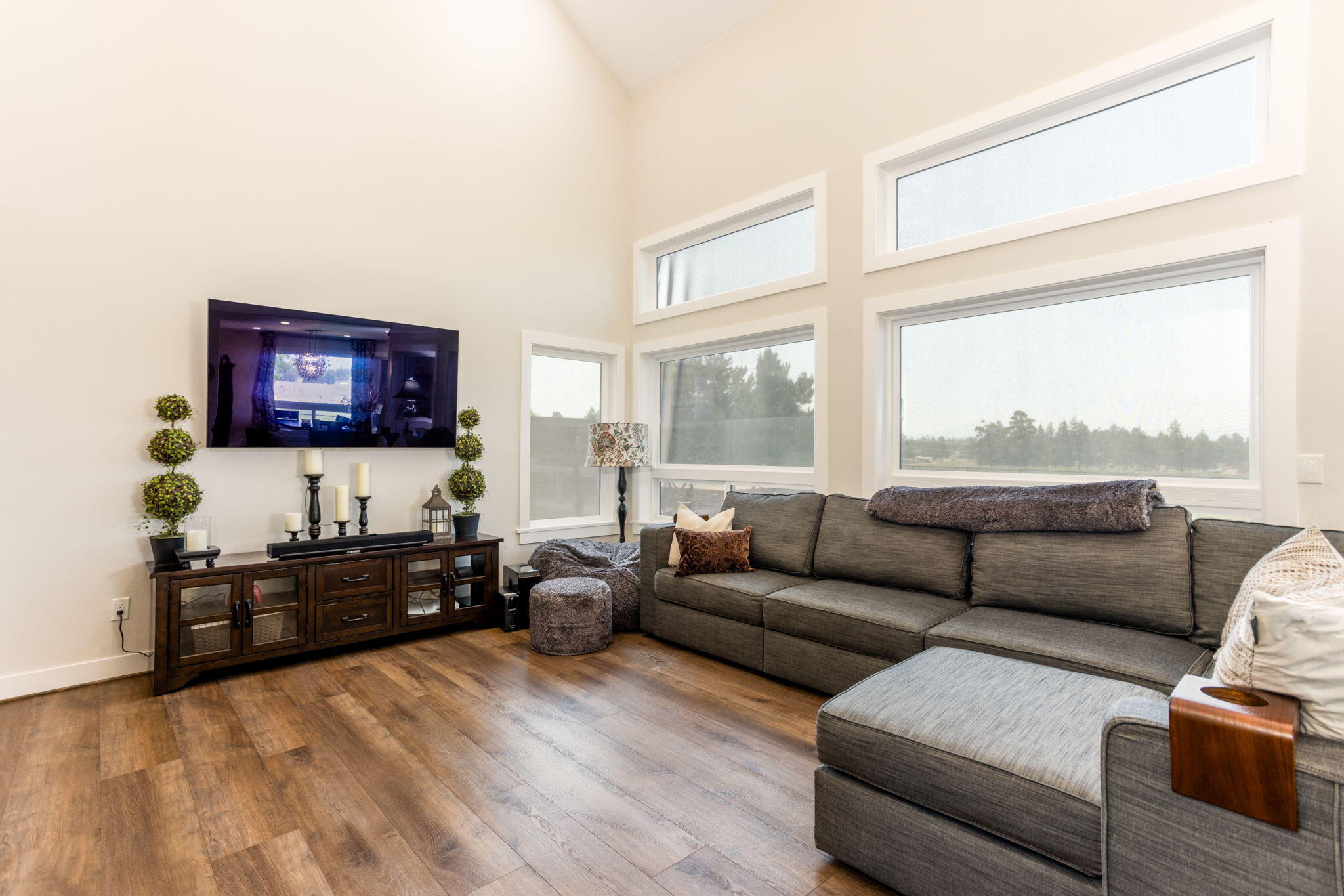 21655 Northeast Butler Market Road Bend, OR 97701 - Photo 11 of 34 a living room with furniture and a flat screen tv