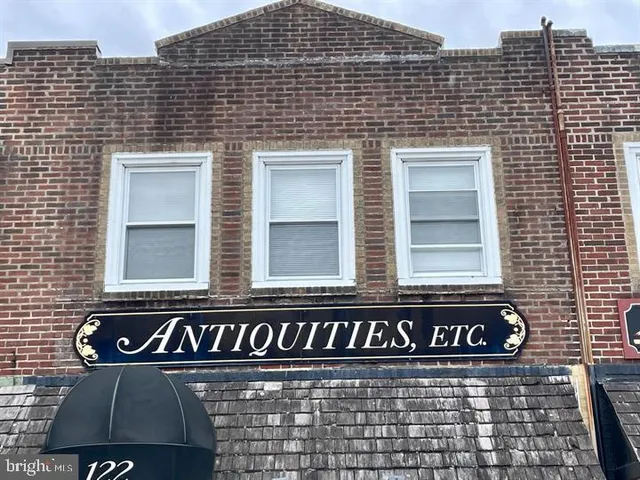 a street sign on a brick wall