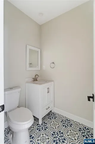 a bathroom with a toilet a sink and a window