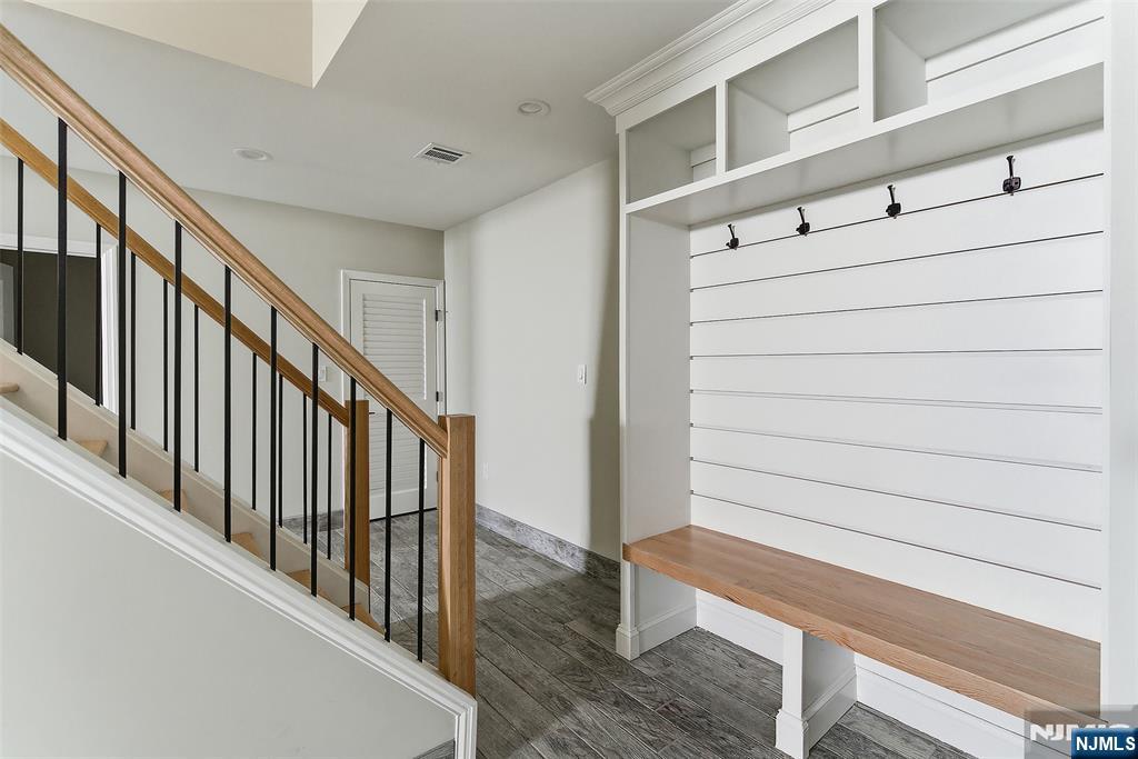 374 Valley Road River Edge, NJ 07661 - Photo 9 of 9 a view of staircase with lots of frames on wall