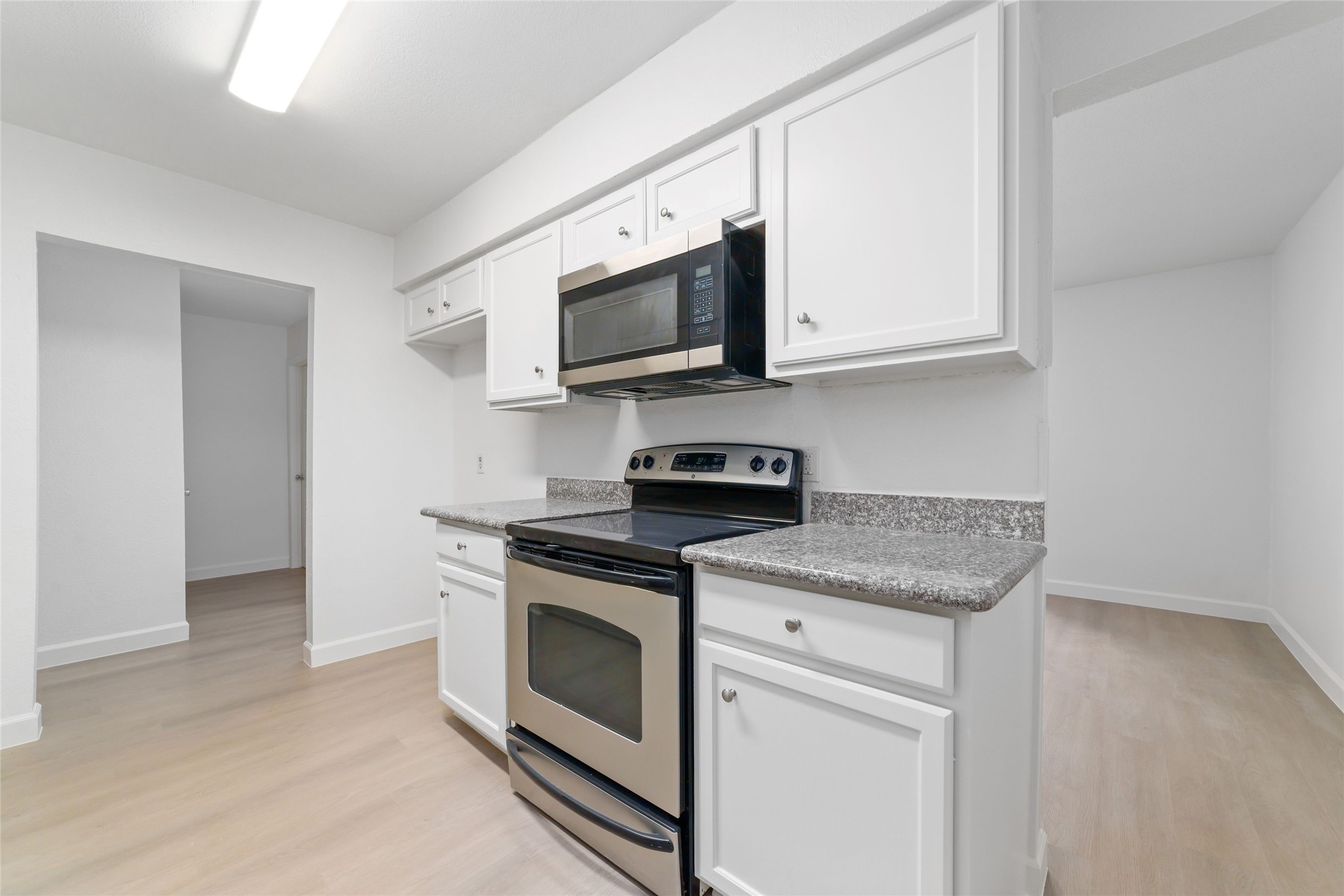 5023 Monteith Drive Spring, TX 77373 - Photo 10 of 20 Another view of the kitchen highlighting the efficient layout and easy flow into adjacent spaces, making it feel open and connected.